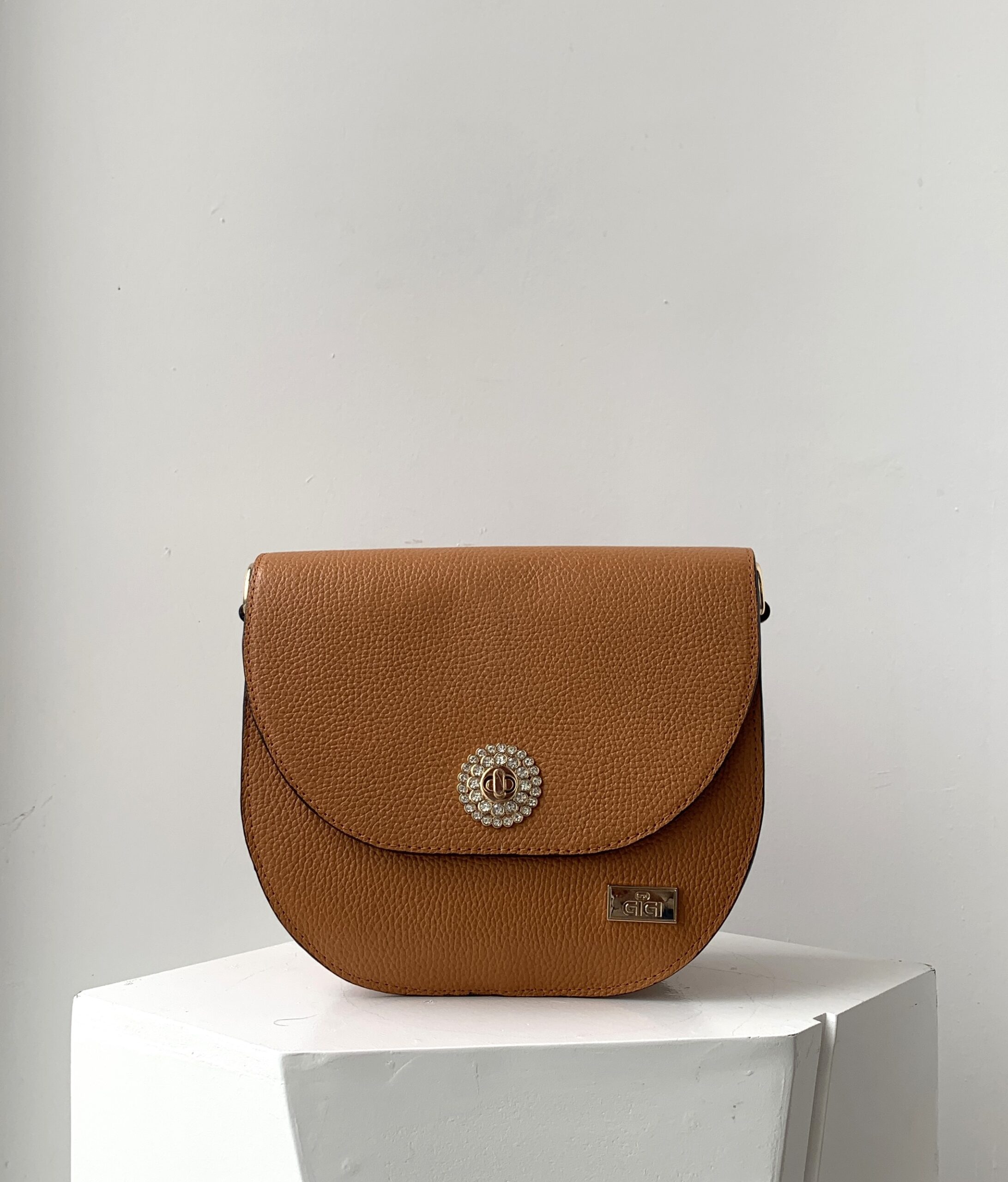 Curved cross body flap bag front